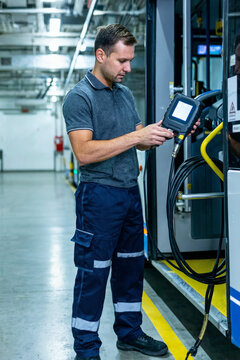 Electric Bus Technician Performing Cable Insulation Test