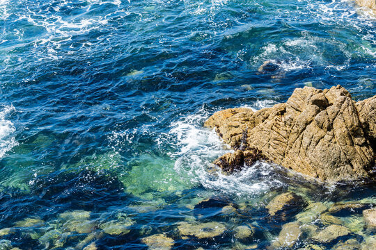 view of rocks in ocean