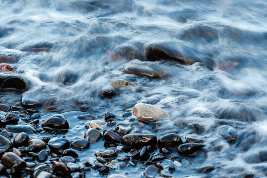 waves flowing over rocks