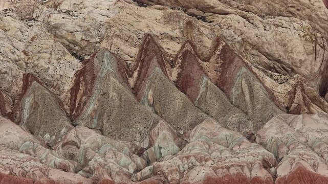 Aerial view of the colorful striped Bentonite Hills landscape with unique geological formations and red clay soil in Hanksville, Utah, United States.