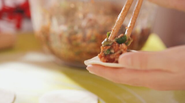  Chinese New Year celebration montage, writing fu character, making dumplings, red lanterns, family reunion dinner Lunar New Year footage