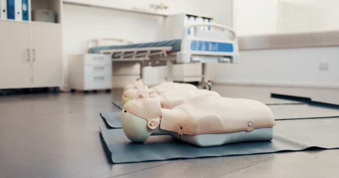 Healthcare, mannequin and CPR practice in clinic, help or training equipment for life support course. First aid, class or dummy on mat for rescue technique, education or medical simulation for health