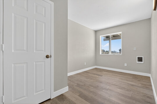 Modern empty room with window and doorway
