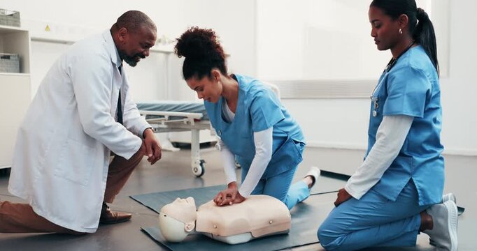 Medical, team and dummy in training for cpr, chest compression and blood flow maintenance in clinic. People, doctor and nurses with mannequin, simulation and life saving procedure for cardiac arrest