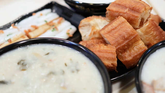 Traditional Hong Kong Breakfast with Congee and Deep Fried Dough Sticks