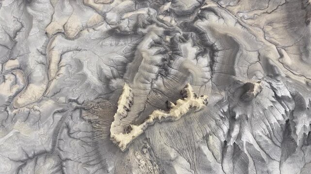 Aerial view of Moonscape Overlook featuring eroded grey desert terrain and intricate ridges in Hanksville, Utah, United States.