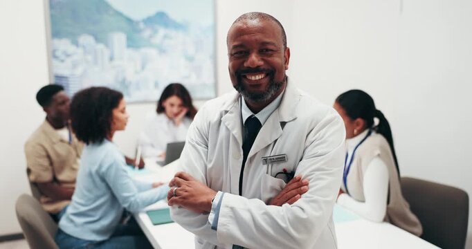 Face, man and doctor in meeting with smile, leadership and medical discussion for patient case. Portrait, mature surgeon and team in office with arms crossed, clinical briefing and healthcare outcome
