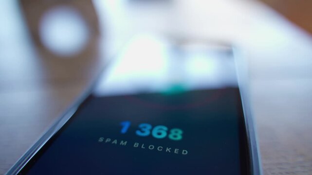 Smartphone screen showing growing number of blocked spam close-up