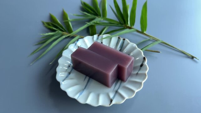 Traditional Japanese Mizu Yokan Red Bean Jelly Served with Bamboo Leaves