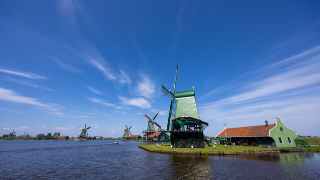 Zaanse Schans landscape with traditional Dutch windmills and blue sky