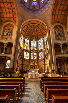 Oosterkerk interior with high vaulted ceiling, arches, and colorful stained glass. in Hoorn, Netherlands