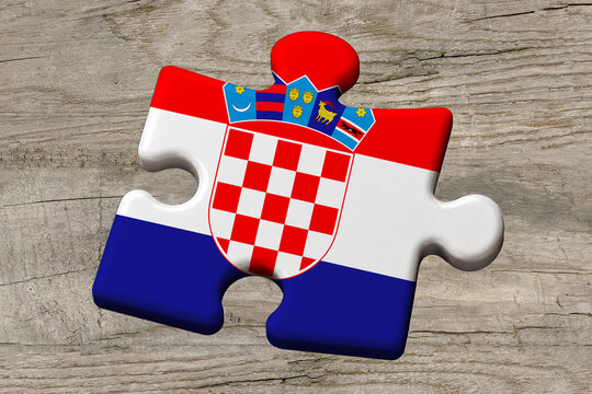 3D illustration. Flag of Croatia on a jigsaw puzzle pieces on a wood background.