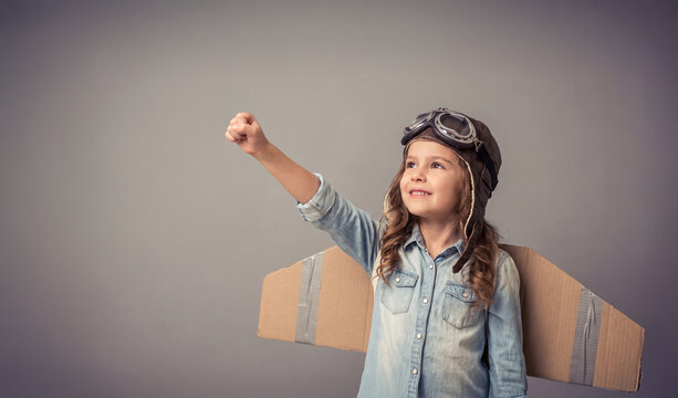 Young Girl Explorer with Cardboard Wings