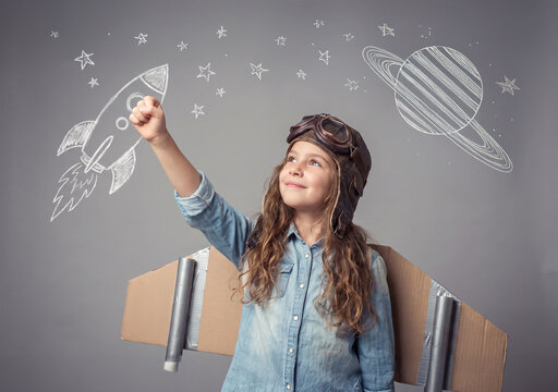 Young Girl Astronaut Pretending to Explore Space