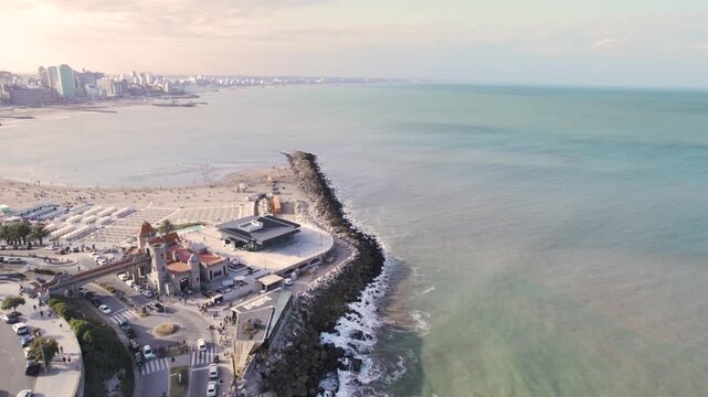 4K drone aerial view of Torre&oacute;n del Monje and Bristol Beach in Mar del Plata, Argentina. Iconic coastal landmark overlooking the sandy beach and the Atlantic Ocean along the city&rsquo;s scenic waterfront.