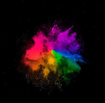 Colorful dust explosion of holi paint powder explosion isolated on black background