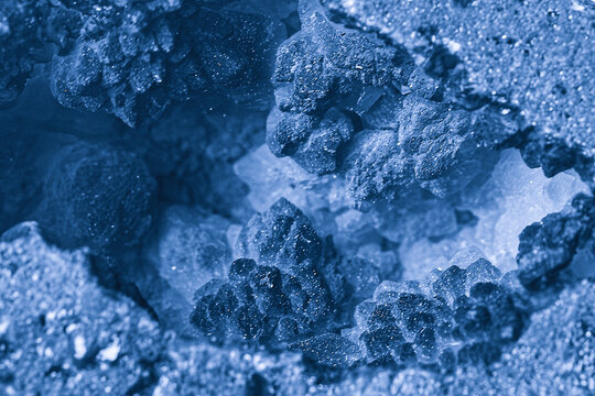Close up of rough geode stone interior with crystalline formations