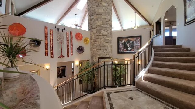 Bright foyer with curved wall and staircase