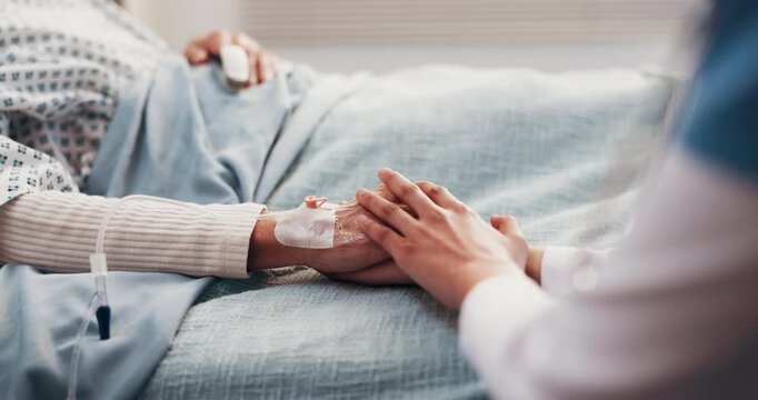 Medical, nurse or old person in hospital with holding hands, comfort or empathy for diagnosis. Wellness, senior patient or doctor with consoling, understanding or sympathy for healthcare results.