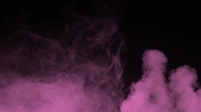 Soft pink smoke billowing upward from bottom corners on black background