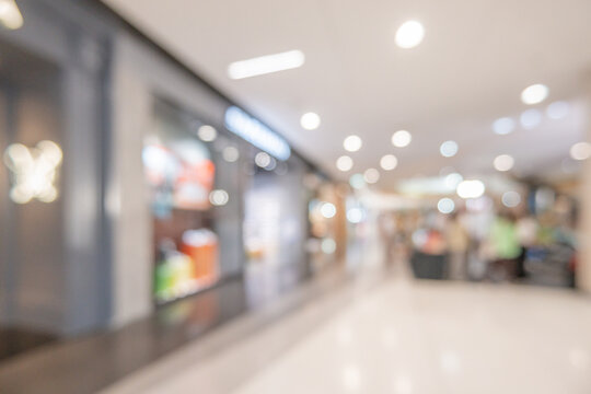 modern luxury shopping mall department store interior blur abstract defocused background with bokeh light