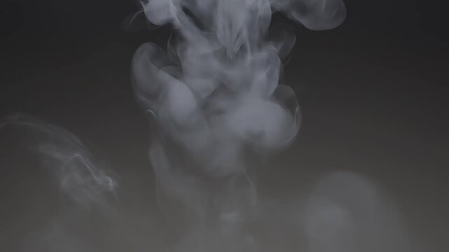 White ink cloud blooming in dark water with subtle light effects creating abstract motion