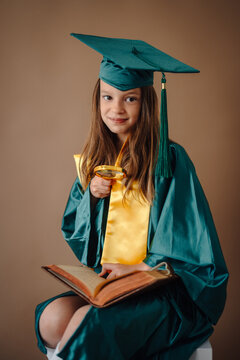 Young child learning with book and magnifying glass