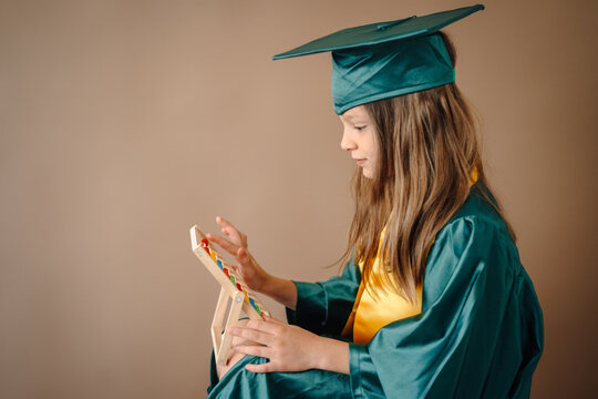 Student graduating learning elementary math with abacus
