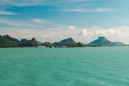 Turquoise Sea and Rugged Island Mountains from Ferry