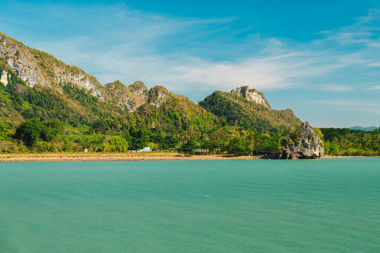 Turquoise Coastal Water and Rugged Limestone Hills at Donsak