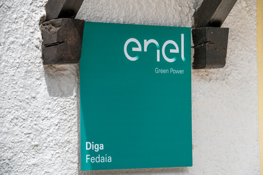 Canazei, Italy - August, 5, 2026 :  Enel Green Power sign at Fedaia Dam in Canazei, Dolomites, Italy