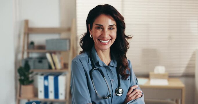 Face, doctor or happy woman in healthcare, arms crossed and proud with professional in clinic office. Mature, physician and confident with laugh for ambition, integrity and experience in medical care