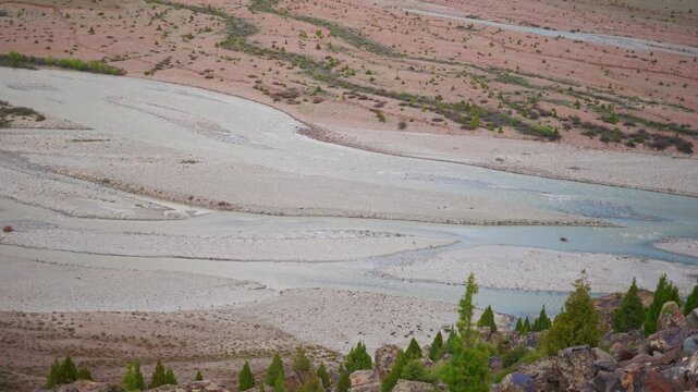 4K Closeup shot of river bed of Bhaga River flowing during the summer season as seen from Darcha village in Lahaul and Spiti district, Himachal Pradesh, India. Scenic Himalayan mountain river.