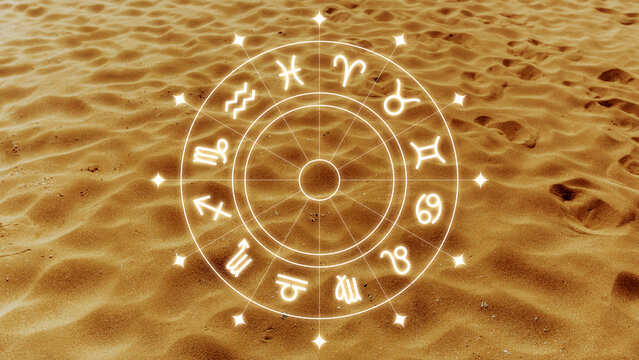 Astrology zodiac signs on a sandy surface with symbols and constellations during daylight