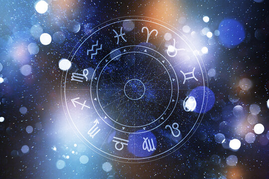 Astrology zodiac signs with symbols and starry background during night time