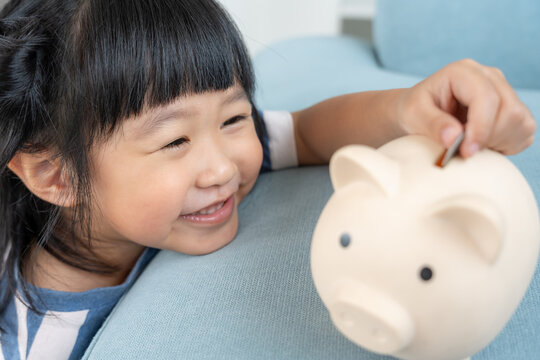 Save money. children putting coin for saving. wealth, Finance, insurance, investment, education, future, plan life, learn, banking, family, health, health and accident insurance.