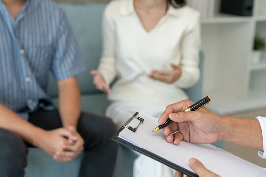 couple with mental health problems is consulting. psychiatrist is recording the patient condition for treatment. encouragement, love and family problem, bipolar , depression patient, protect suicide