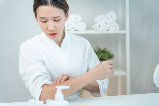 skin problem and beauty. Young woman scratch body has itchy skin from skin allergic, steroid allergy, sensitive skin, red from sunburn, chemical allergy, rash, insect bites, Seborrheic Dermatitis.