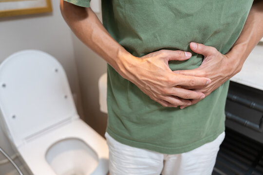 Constipation and diarrhea in bathroom. Hurt man touch belly  stomach ache painful. colon inflammation problem, toxic food, abdominal pain, abdomen, constipated in toilet, stomachache, Hygiene