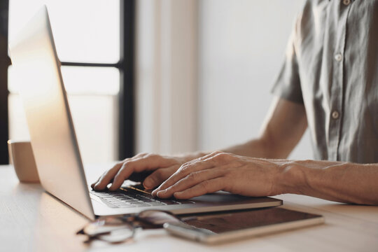 Man hands typing on computer keyboard closeup, businessman or student using laptop, online learning, internet marketing, people working office workplace, freelance concept