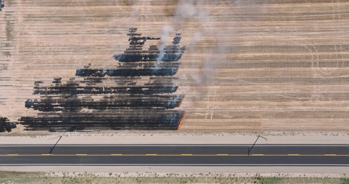 Tanks arranged in field, smoke trails visible