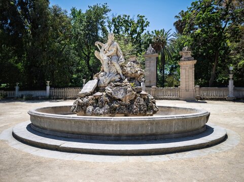 Captivating travel view of the iconic Fontana del Genio inside Palermo's Villa Giulia, perfect for Sicilian holiday brochures, cultural guidebooks, and travel editorial media.