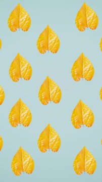 Animation of rows of autumn yellow leaves on blue background