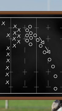 On field, player in action with football strategy animation on chalkboard