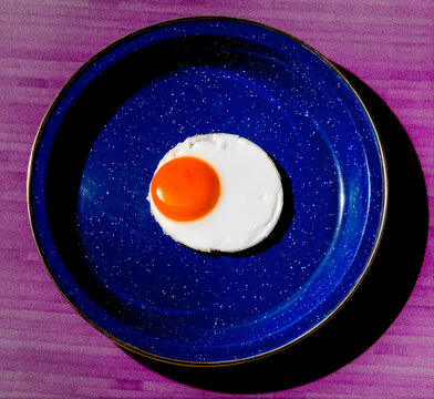 Fried Egg on Speckled Blue Plate