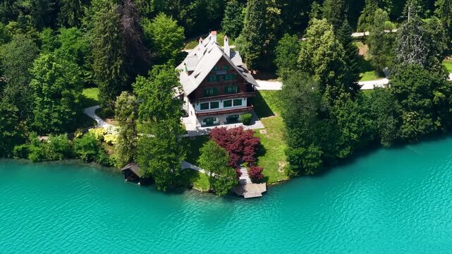 Drone Shot of Lakefront Villa and Landscape by Glacial Blue Water of Lake Bled, Slovenia