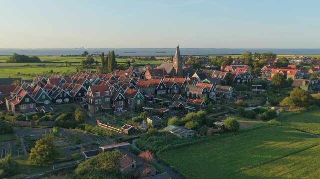 Picturesque aerial perspective of the historic village of marken in the netherlands, showcasing traditional wooden houses and scenic countryside