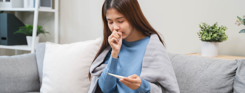 People sick in winter season, young woman coughing and feeling sore in her throat.