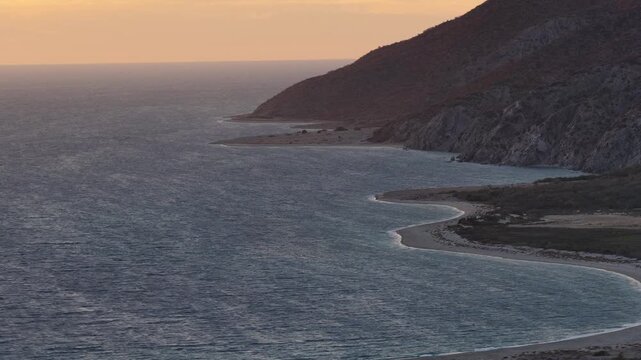 Aerial view of the rugged coastal landscape and beach at Isla Cerralvo near La Paz, Mexico.