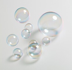 Obraz premium Colorful soap bubbles floating on white background
